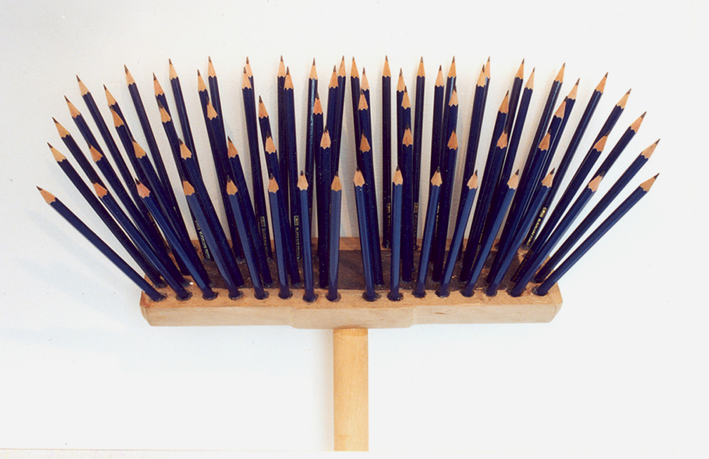 A broom head constructed with pencils