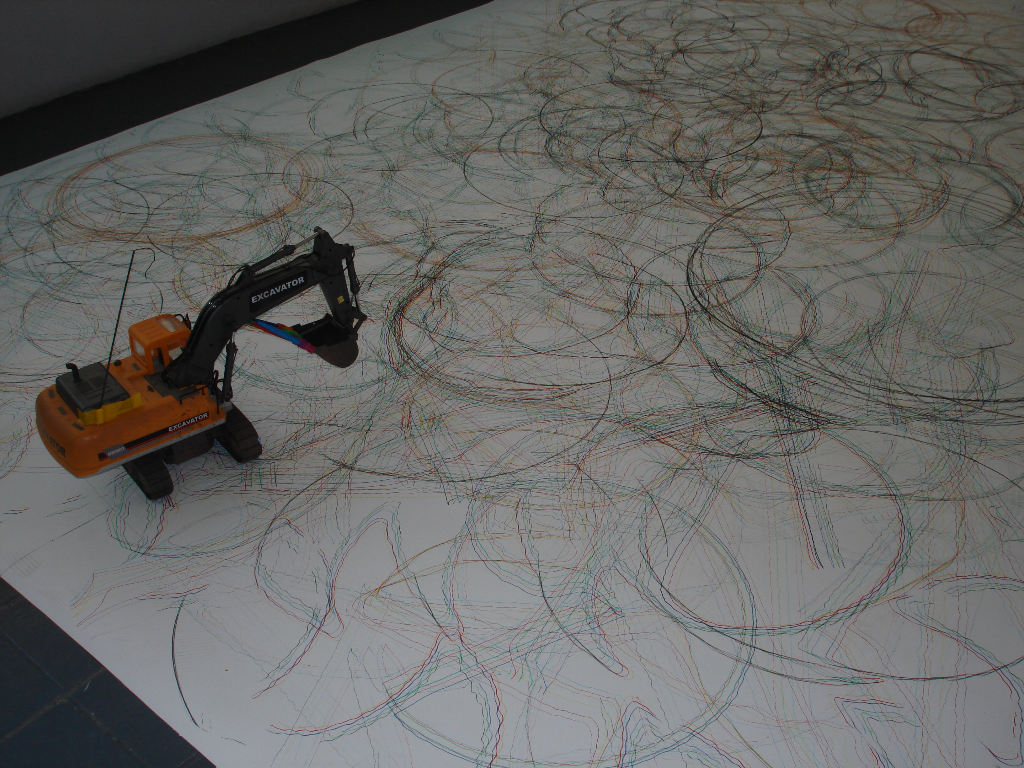 remote-contolled-digger-drawing-on-paper